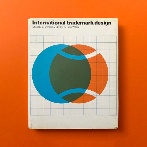 "International Trademark Design: A Handbook of Marks of Identity" by Peter Wildbur, a 1979 guide to global trademark history, design principles, and iconic logos.